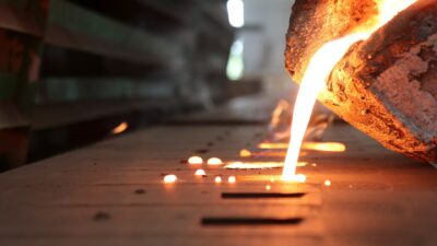 Light,From,High,Temperature,Iron,Molten,Metal,Pouring,In,Green