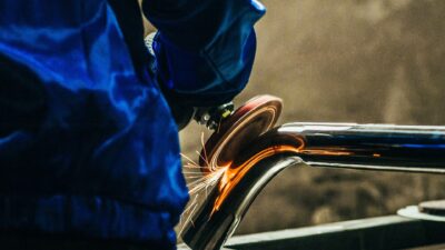 Metal,Polishing,With,A,Hand,Sander,With,A,Polishing,Disk.